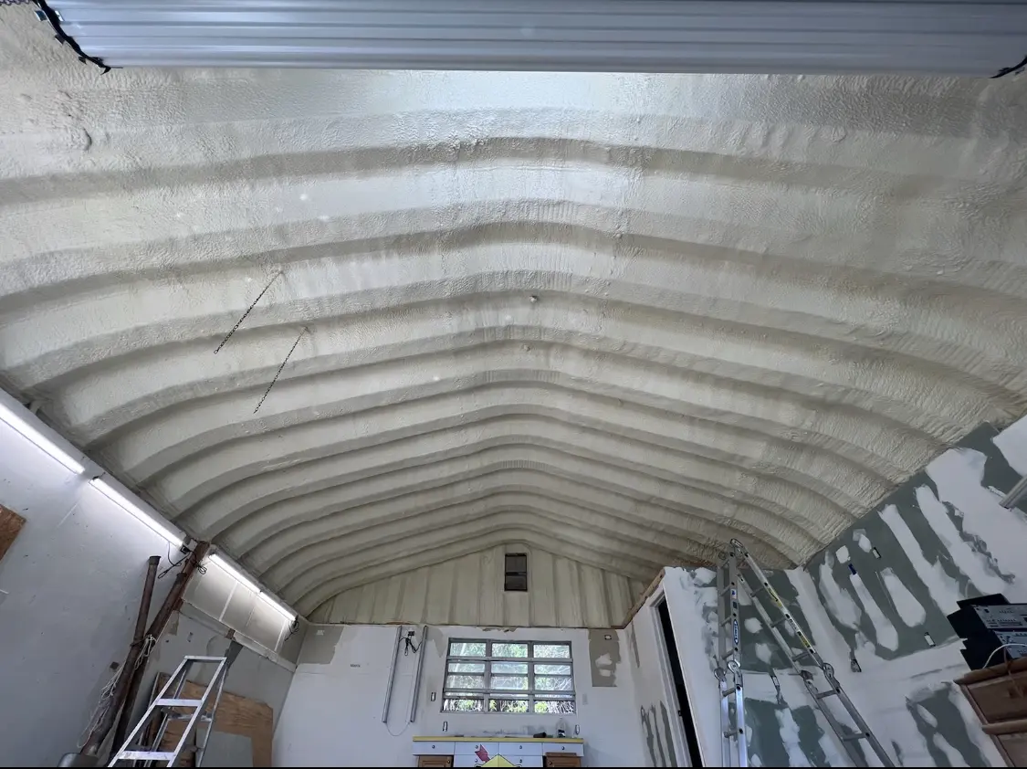 Spray polyurethane foam applied to the underside of a metal roof deck in Opa-locka